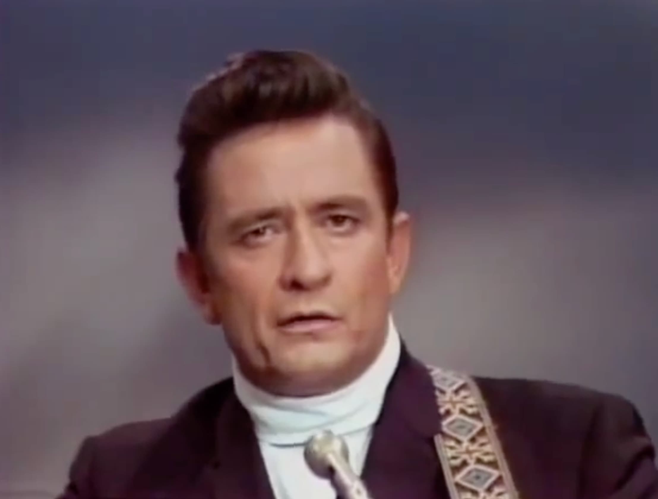 Johnny Cash performs “Ring of Fire” at the Grand Ole Opry, 1965. 